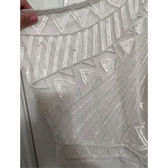 One shoulder white jumpsuit from Eloquii.
Size 18
Beaded detail on top.
Purchase - Picture 10 of 11